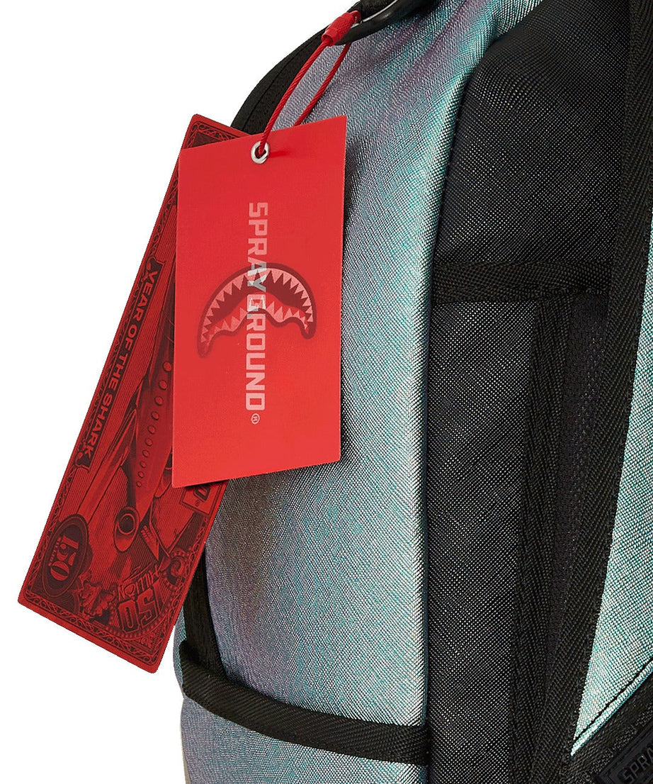 Sprayground - शार्क सेंट्रल ऑयल स्टीक डीएलएक्सस बैकपैक